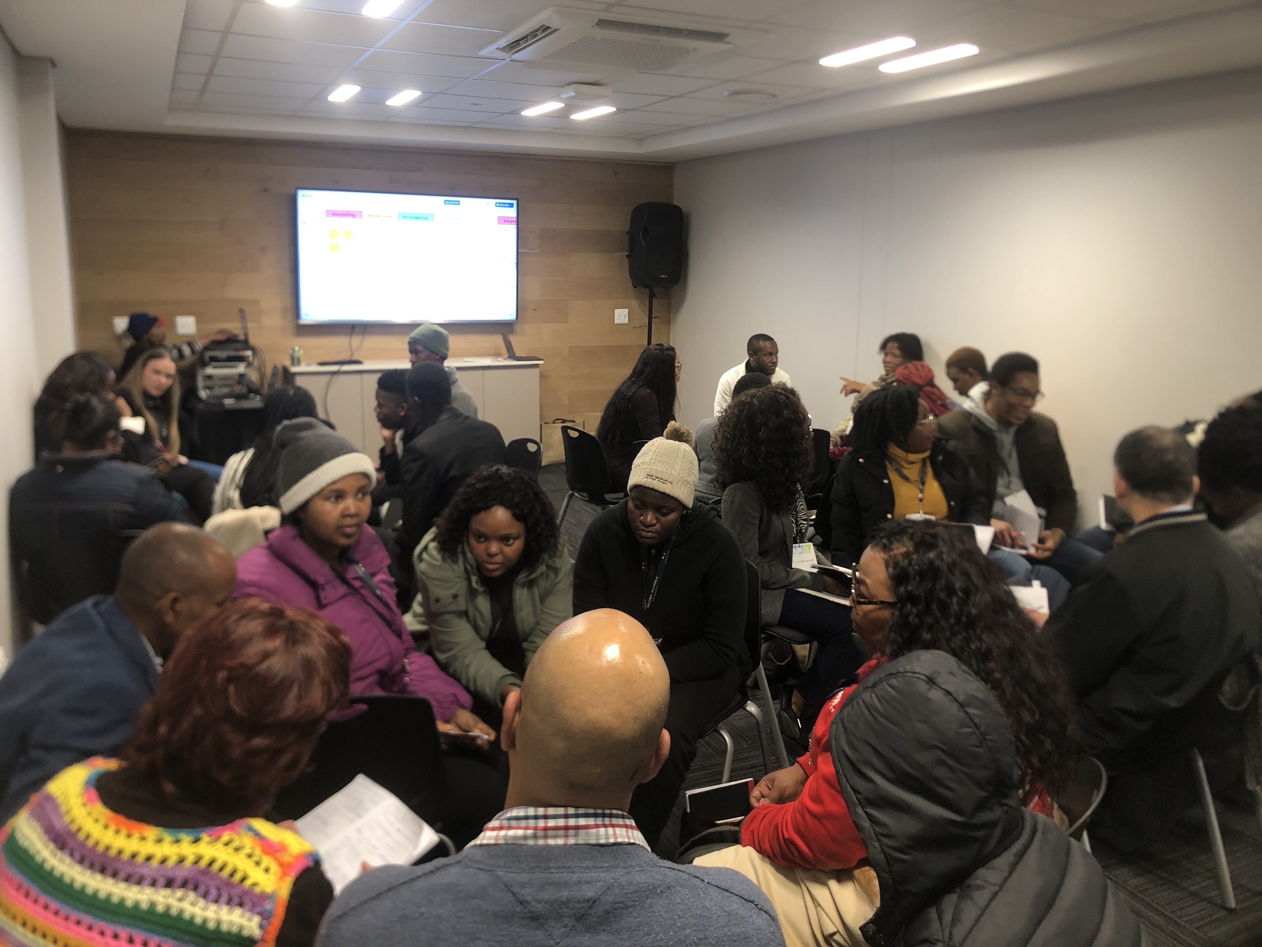 Cocreation activity in smaller groups at the SRI conference.